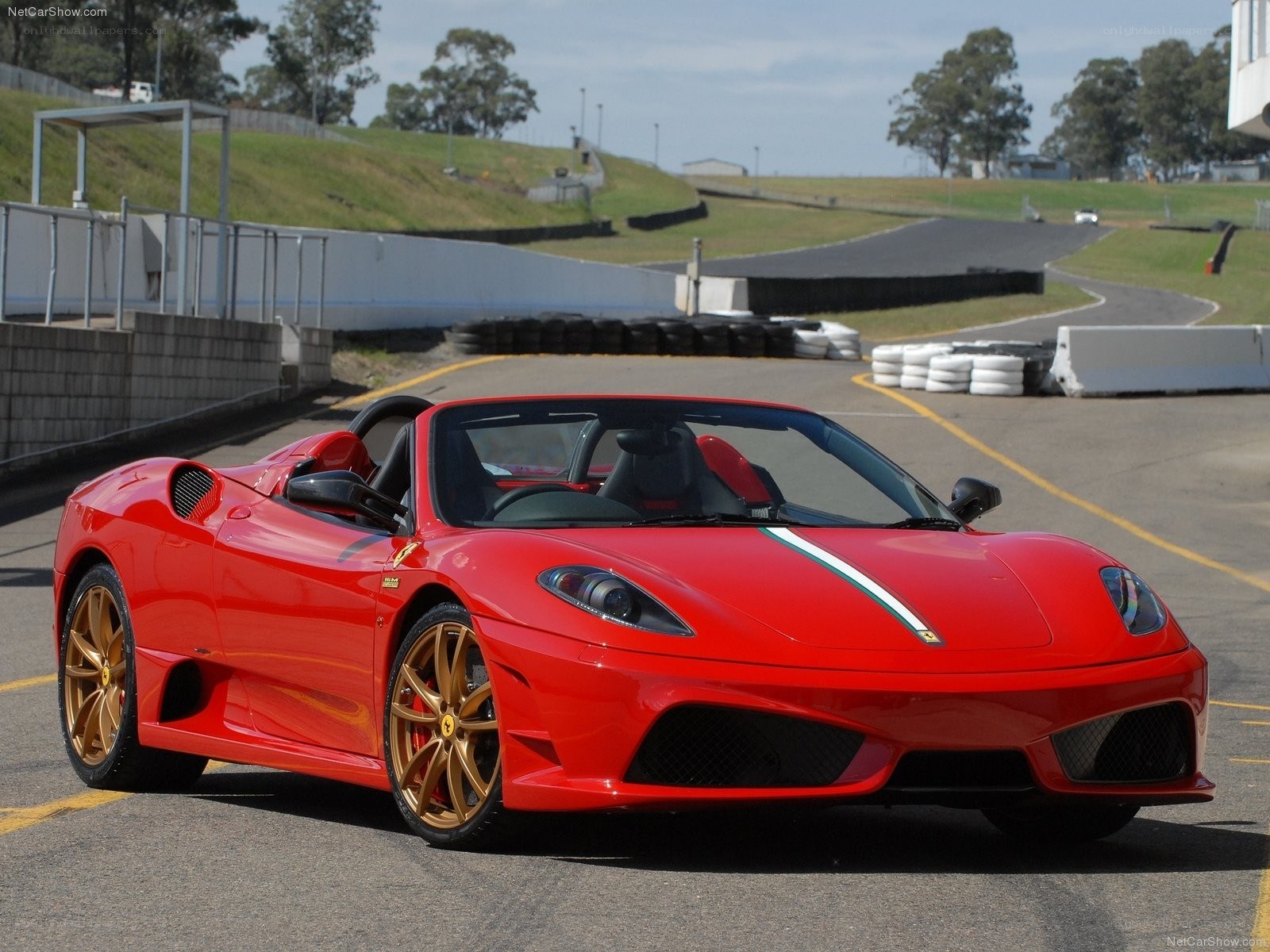 red ferrari on racetrack
