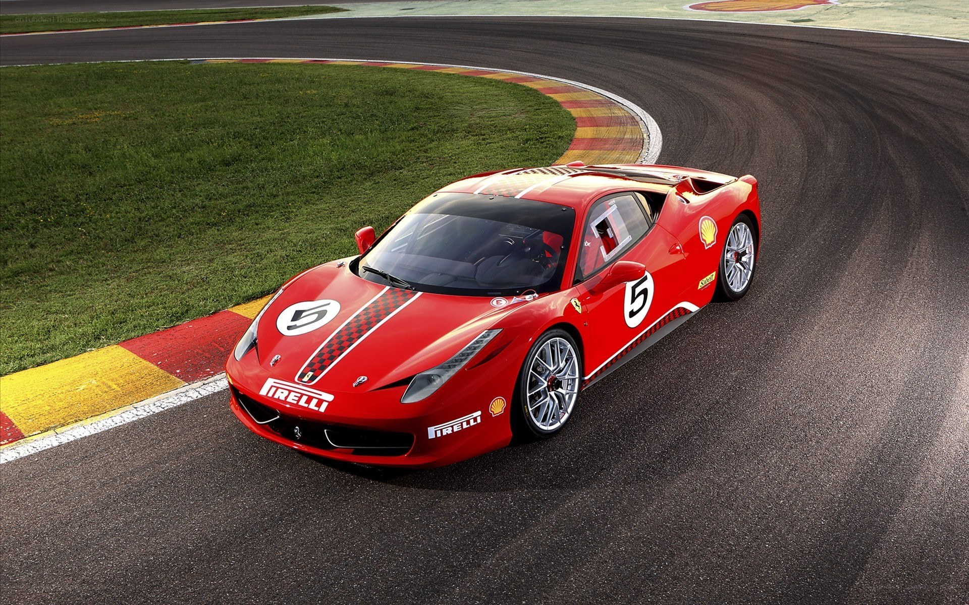 Red Ferrari on racetrack