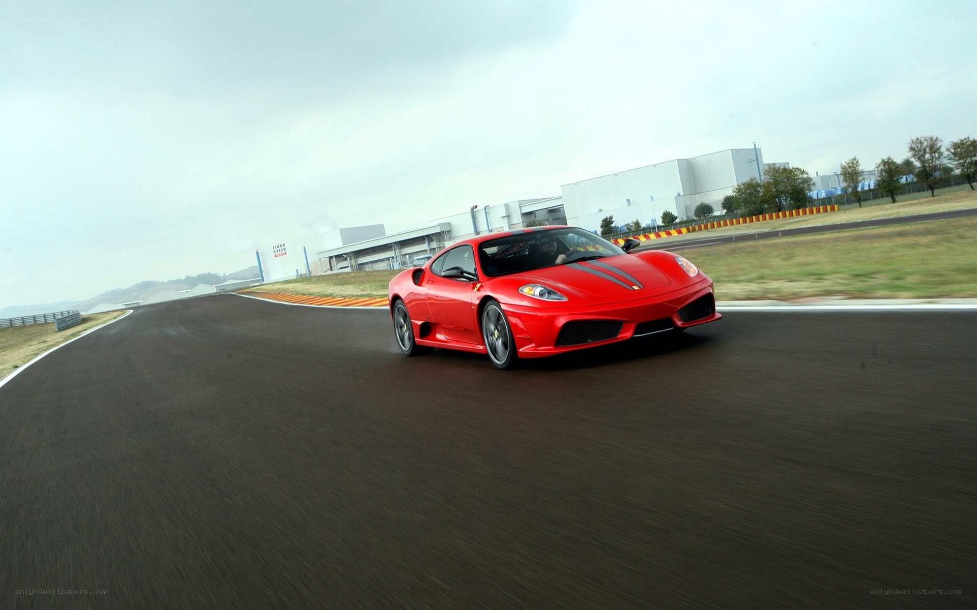 Red Ferrari on racetrack