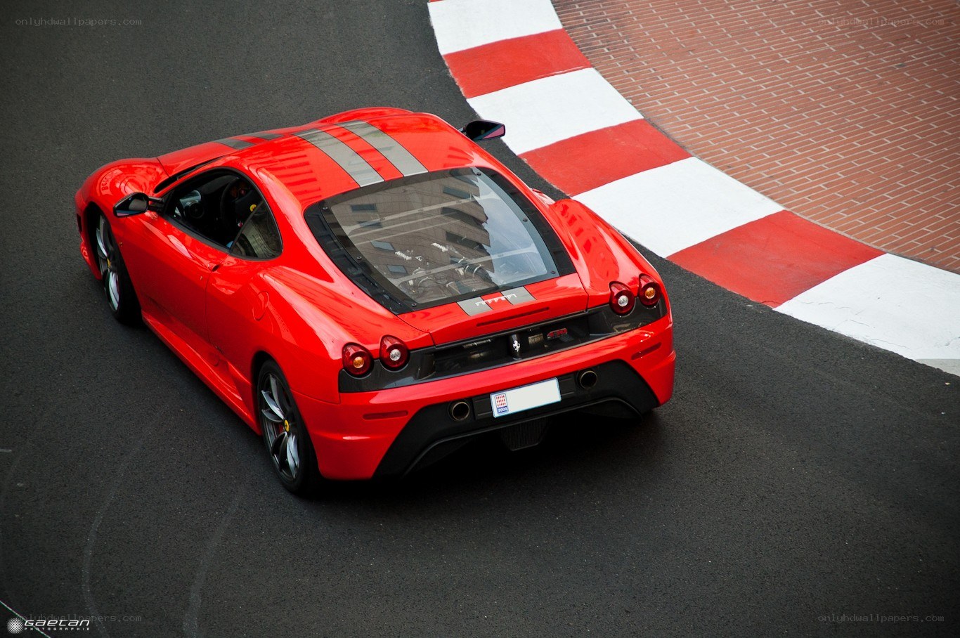 red ferrari on racetrack