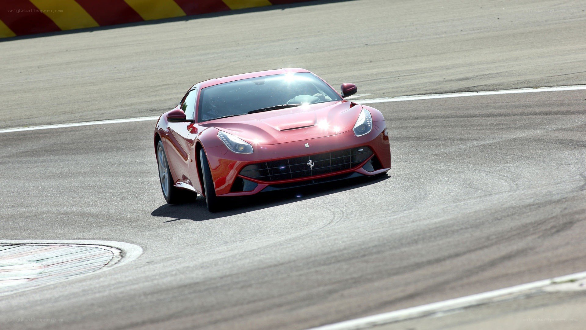 Red Ferrari on racetrack