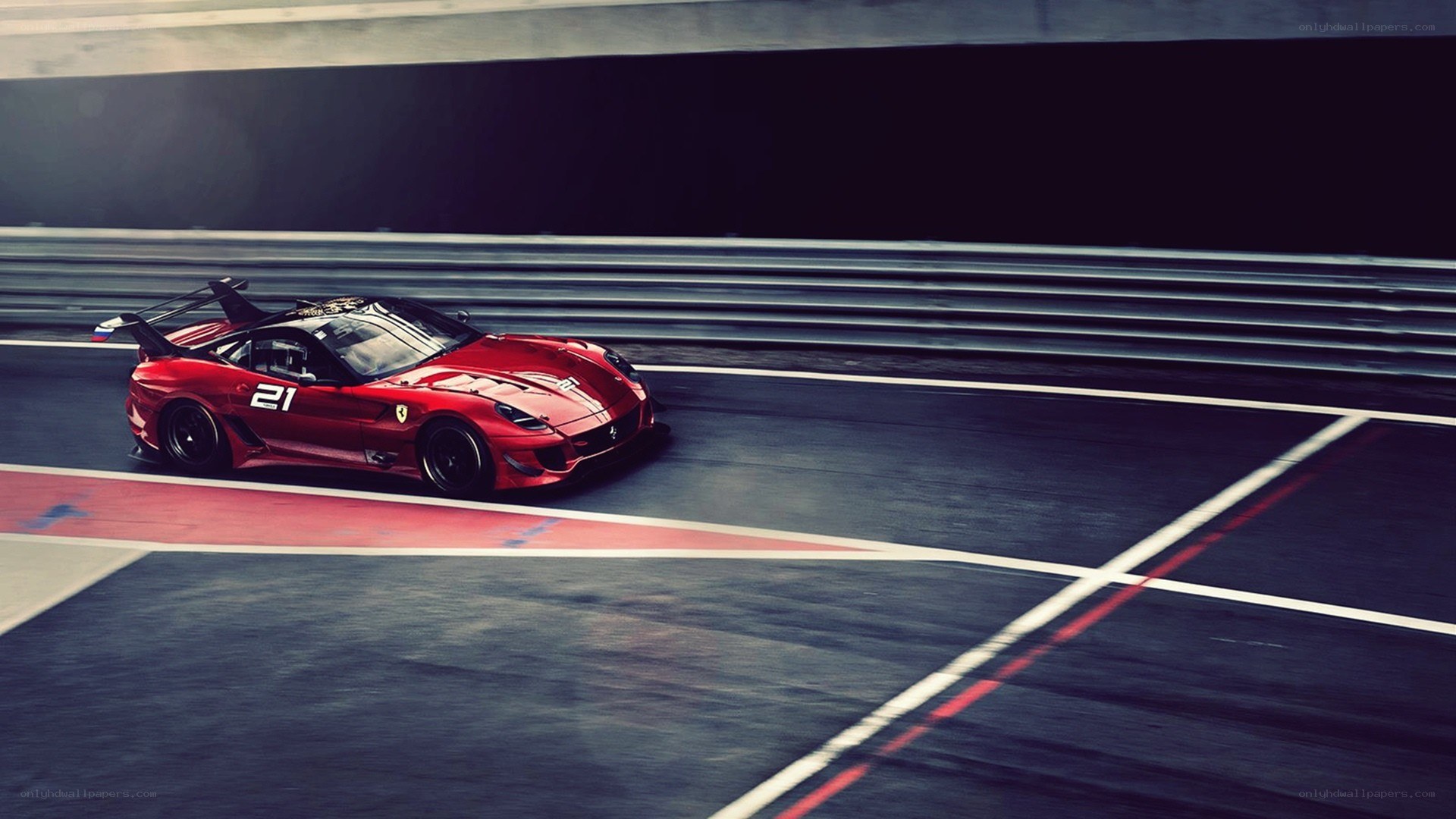 Red Ferrari on racetrack