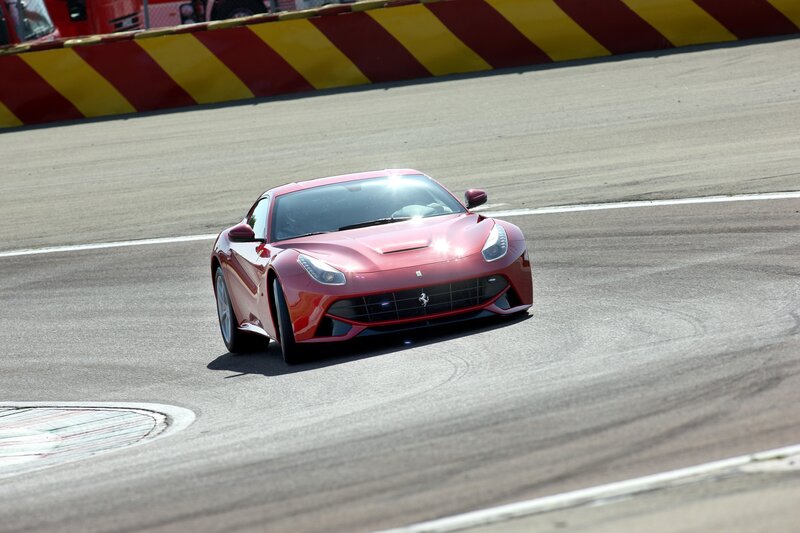 Red Ferrari on racetrack