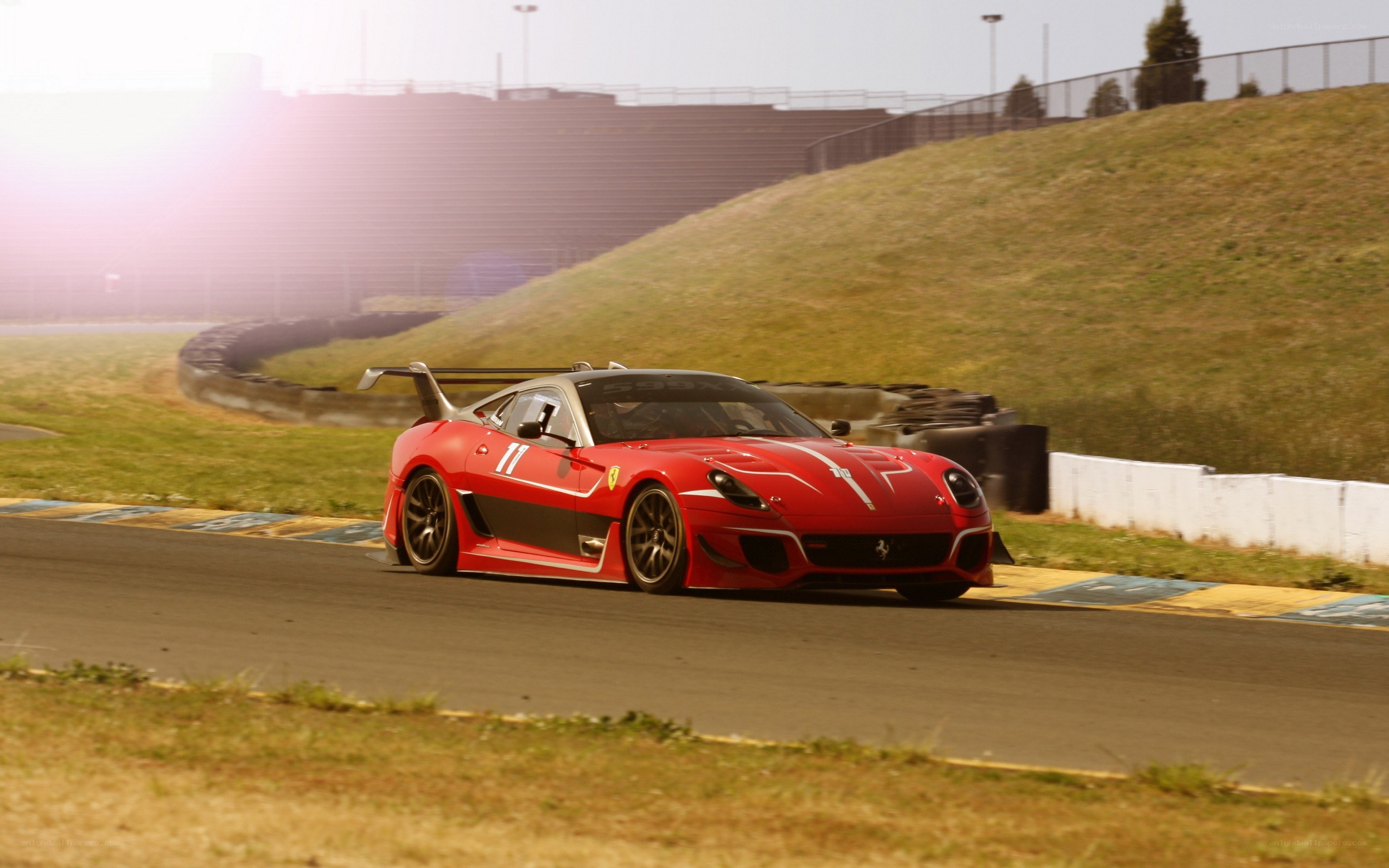 Red Ferrari on racetrack