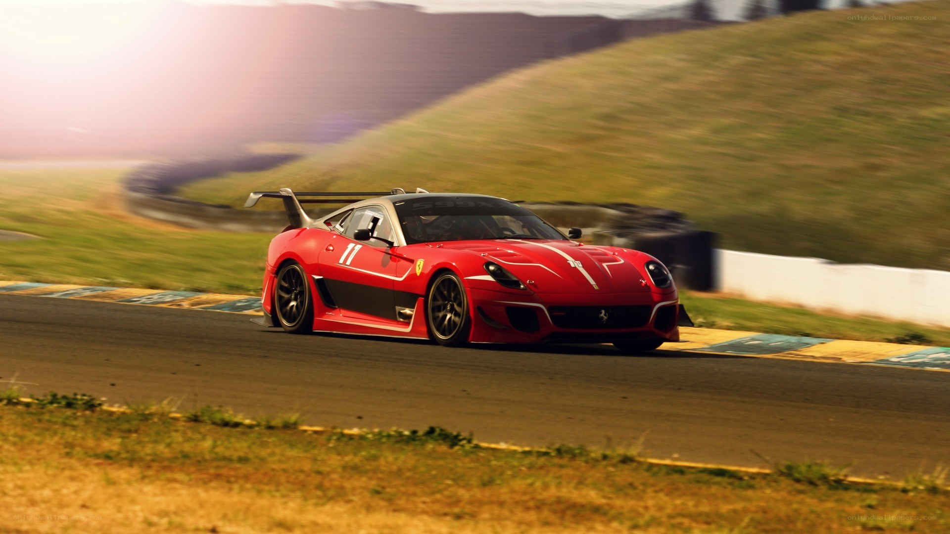 red ferrari on racetrack