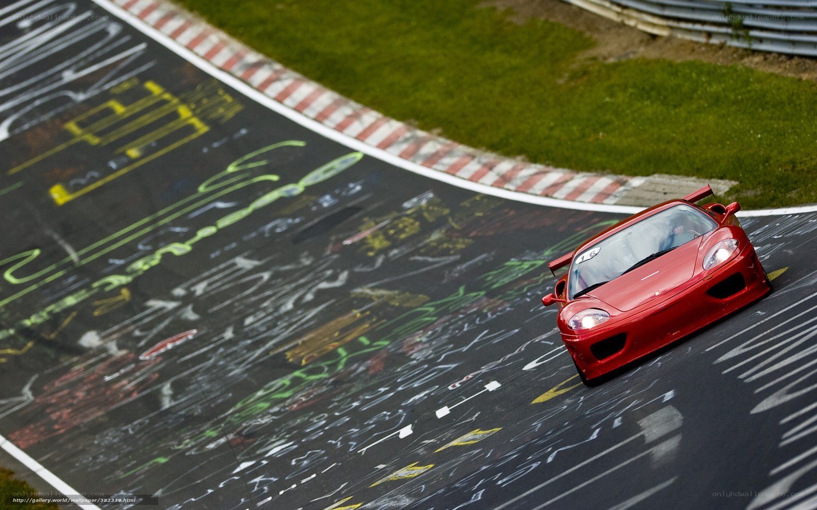 Red Ferrari on racetrack