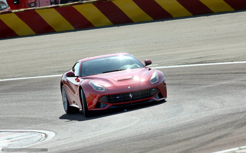 Red Ferrari on racetrack