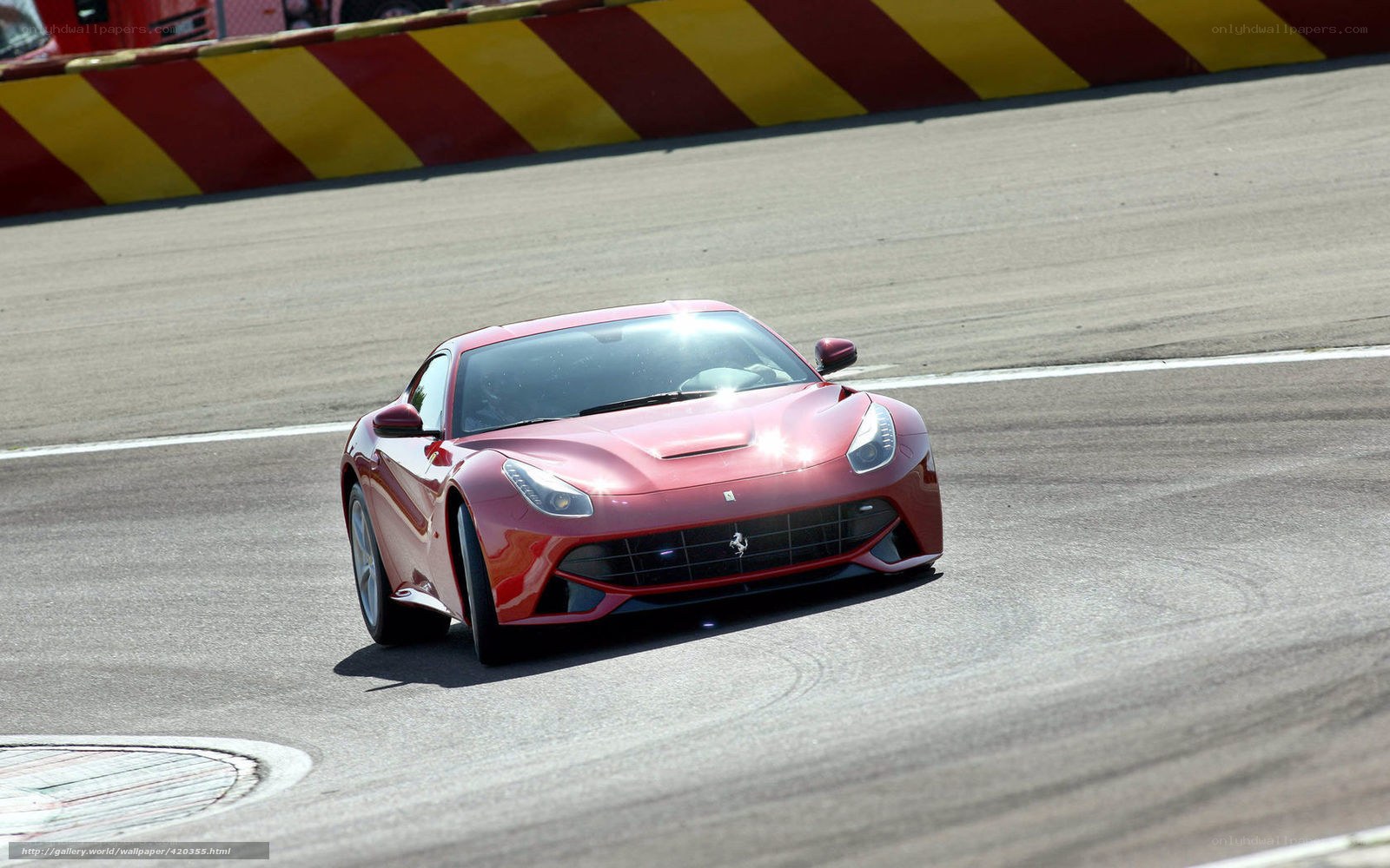 Red Ferrari on racetrack