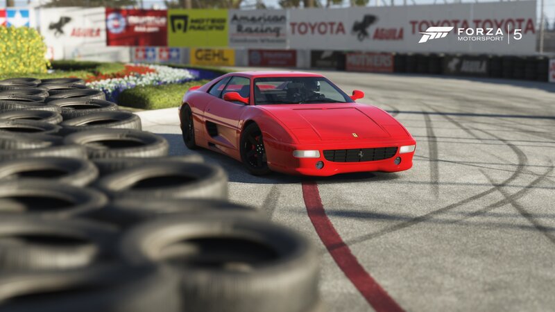 Red Ferrari on Racetrack — Competitive