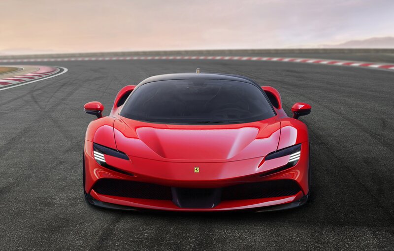 Red Ferrari on Racetrack — Dramatic, Sunset
