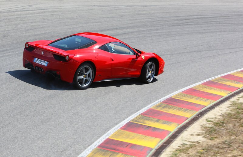 Red Ferrari on Racetrack — Dynamic, Afternoon, Photograph, Car, Tire Marks, Gray
