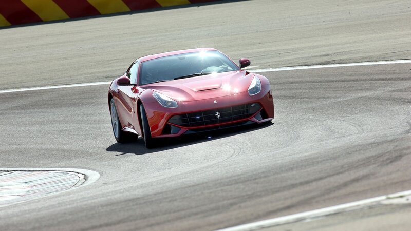 Red Ferrari on Racetrack — Dynamic, Afternoon, Photograph, Car, Tire Marks