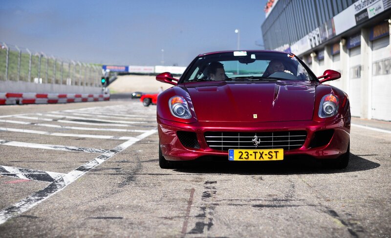 Red Ferrari on Racetrack — Dynamic, Afternoon, Photograph, Race Track, Car