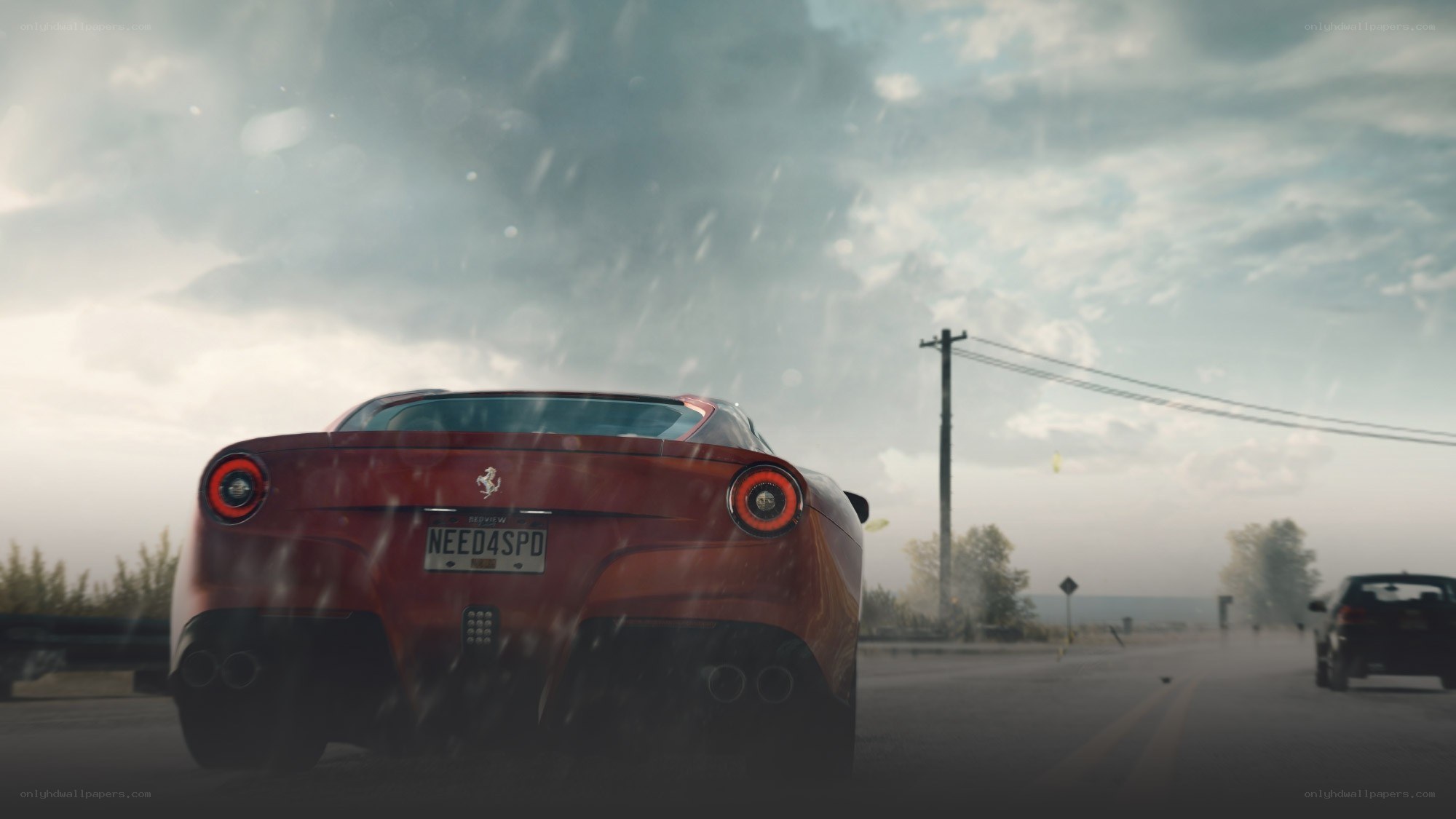red ferrari on rainy road
