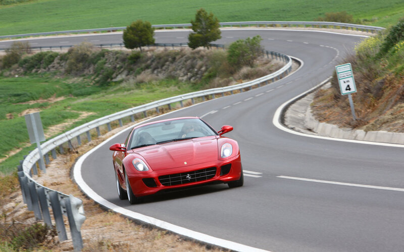Red Ferrari on Road — Dynamic, Afternoon, Photograph, Car, Guardrail