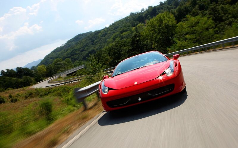 Red Ferrari on Road — Dynamic, Afternoon, Photograph, Car, Trees, Guardrail