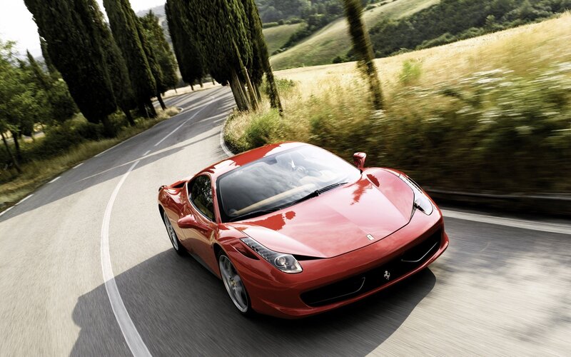 Red Ferrari on Road — Dynamic, Afternoon, Photograph, Car, Trees, Hills, Green