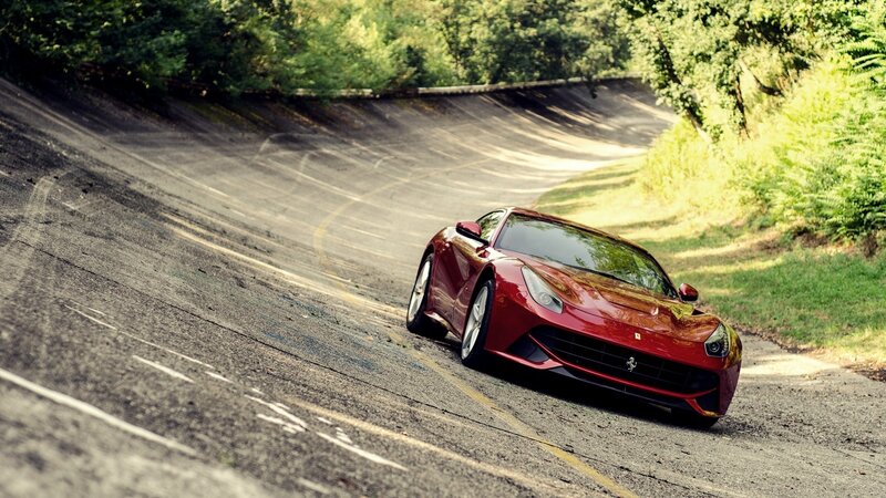 Red Ferrari on Road — Green