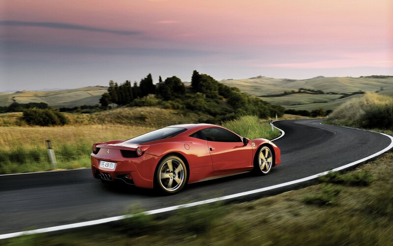 Red Ferrari on Road — Hills