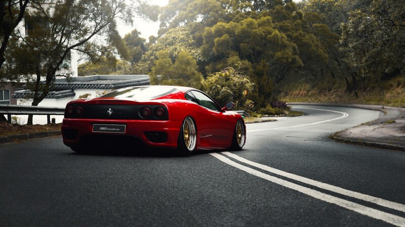 Red Ferrari on Road — Serene, Morning