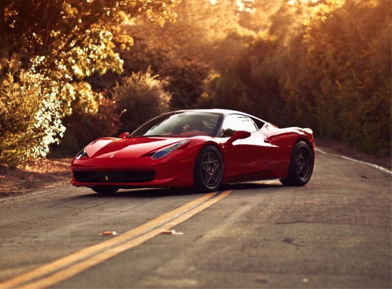 Red Ferrari on Road — Serene, Sunset