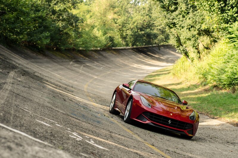 Red Ferrari on Road — Trees