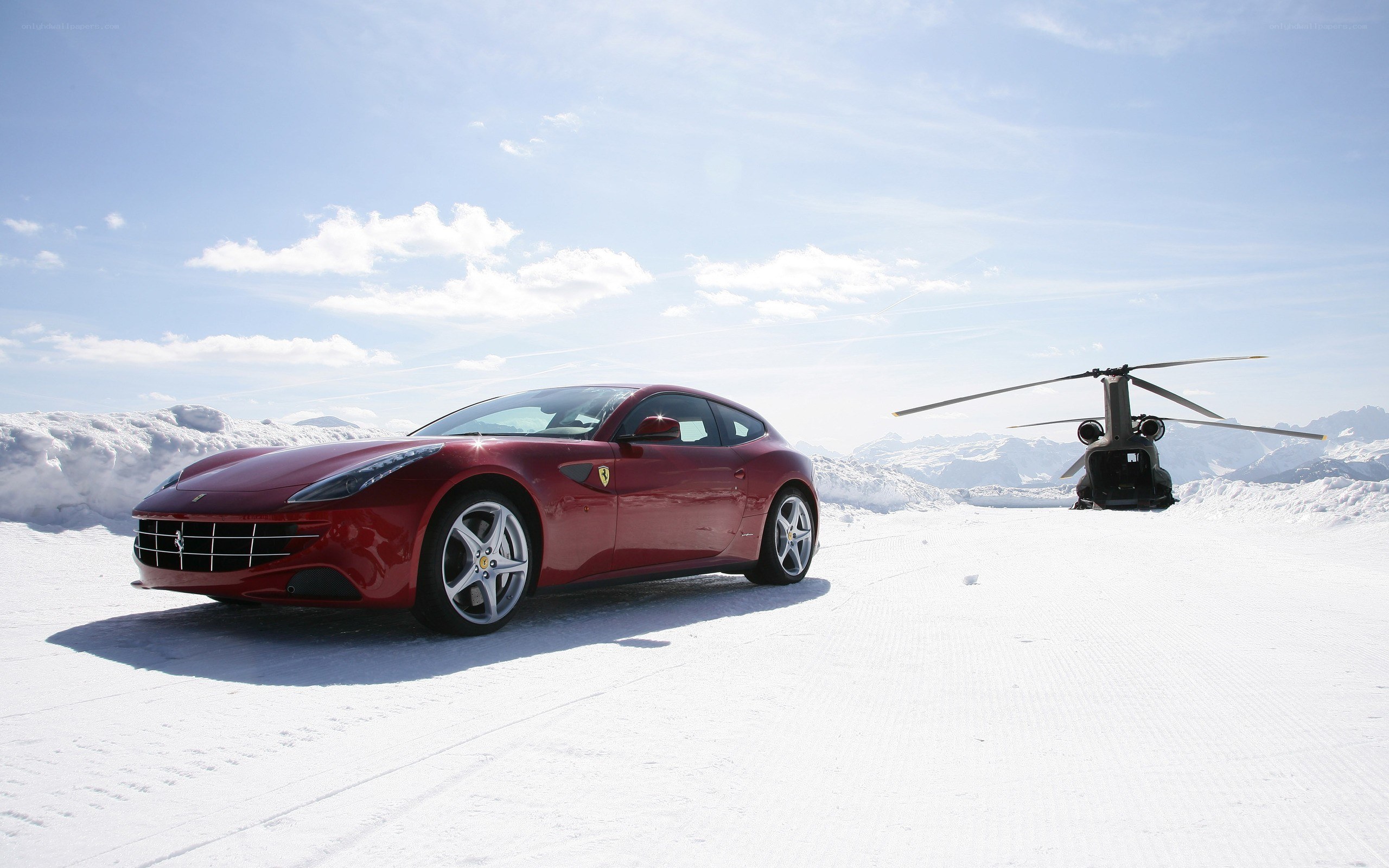 Red Ferrari on snowy mountain