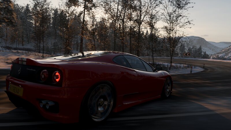 Red Ferrari on Snowy Road — Dynamic