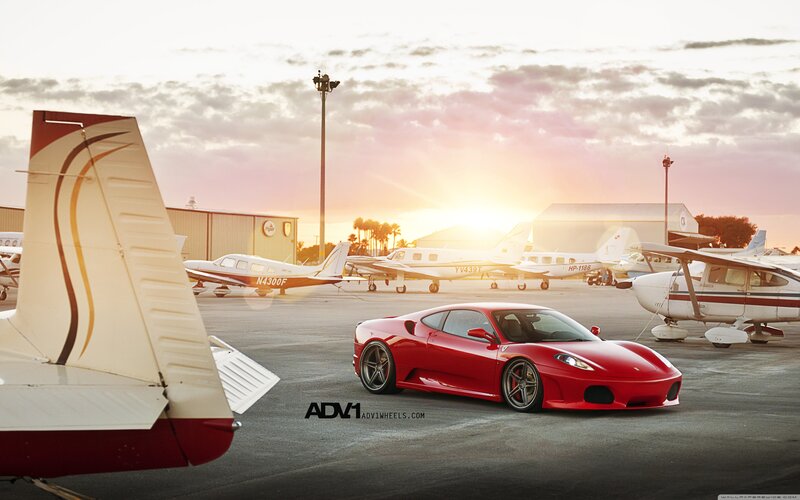 Red Ferrari on Tarmac — Dramatic, Sunset, Photograph