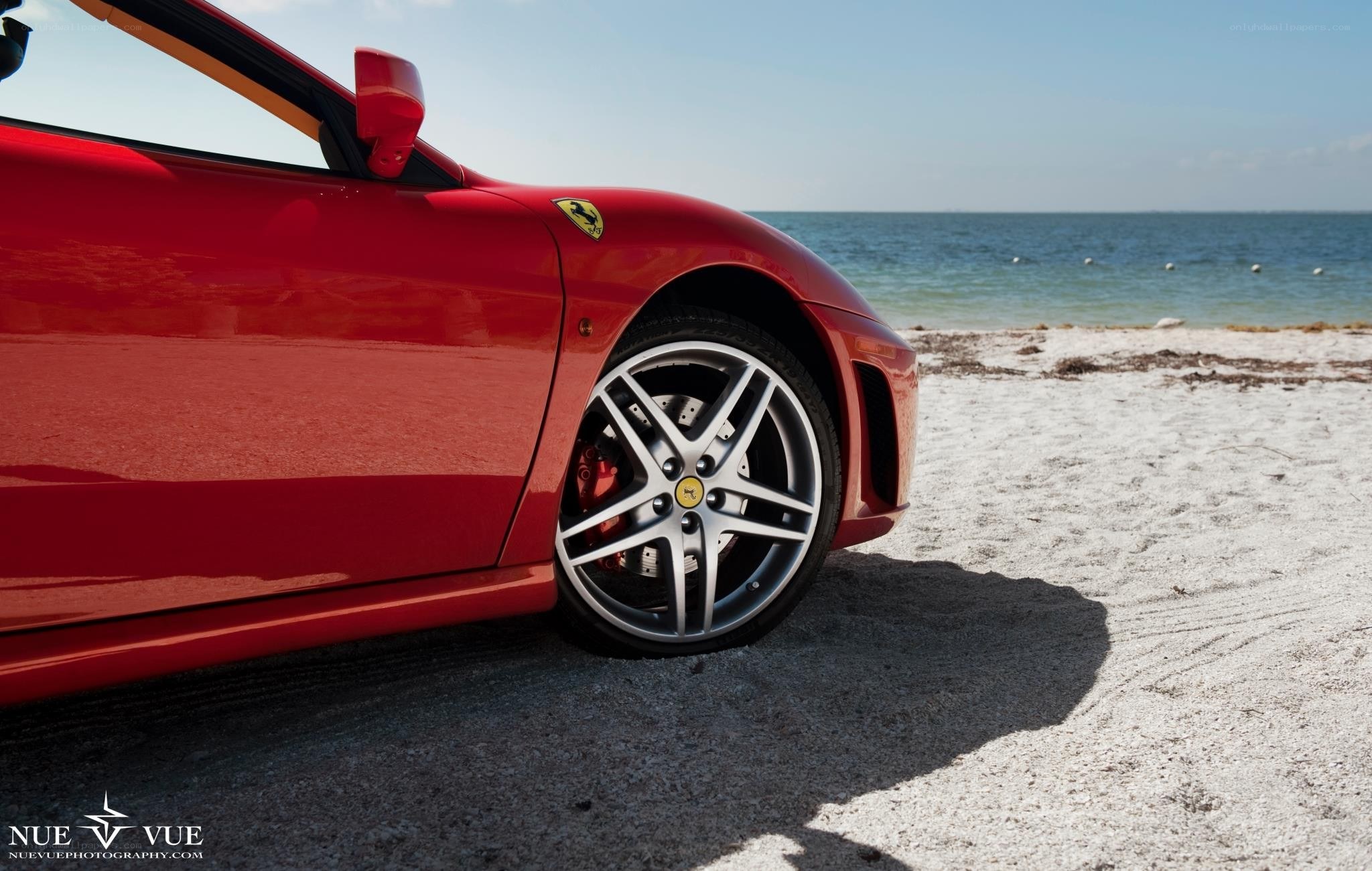 Red Ferrari on the beach