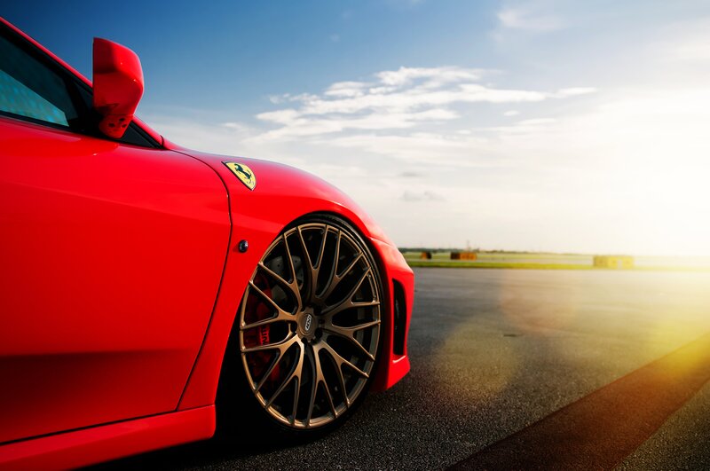 Red Ferrari on Track — Dramatic, Sunset, Photograph