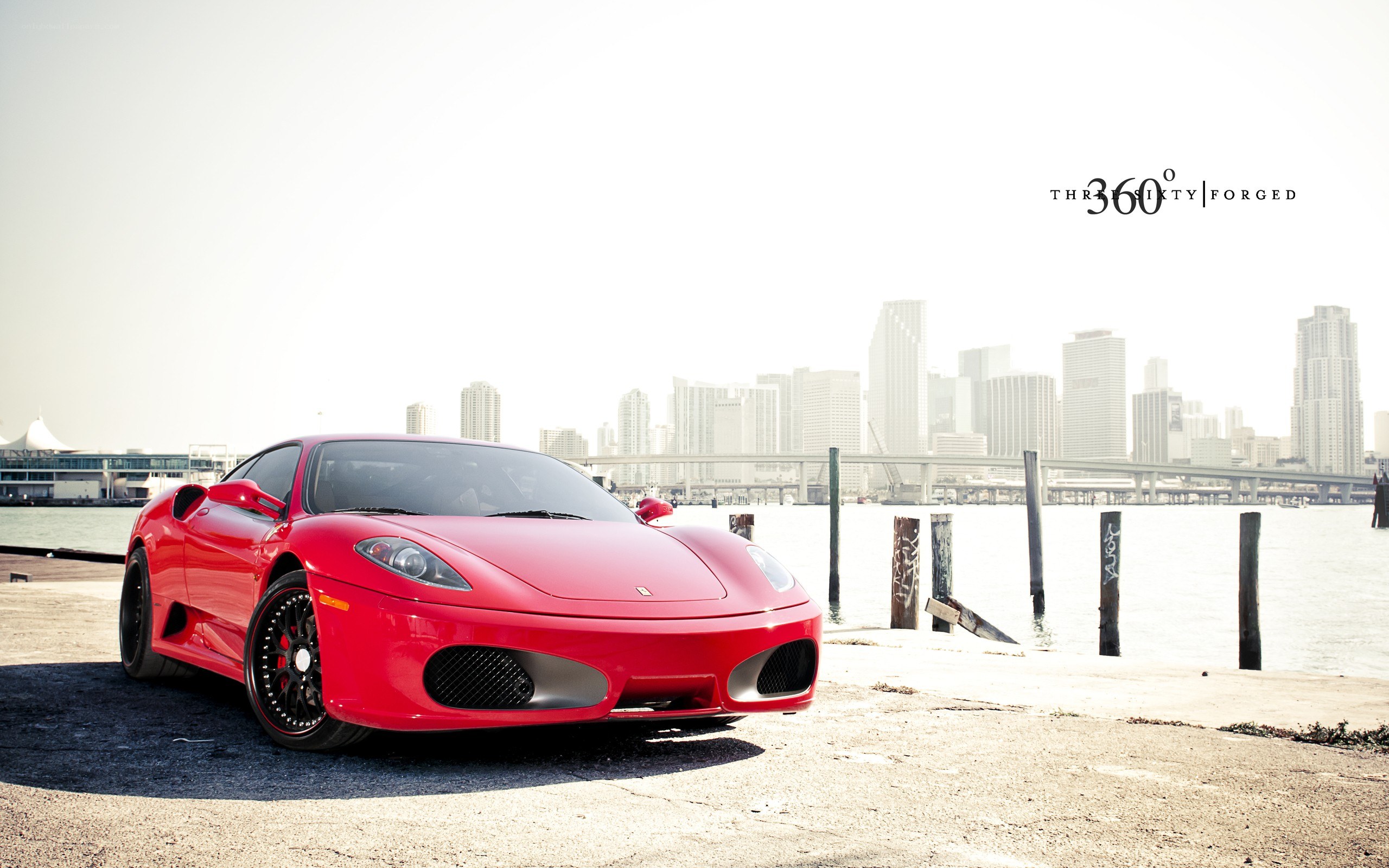 Red Ferrari on waterfront