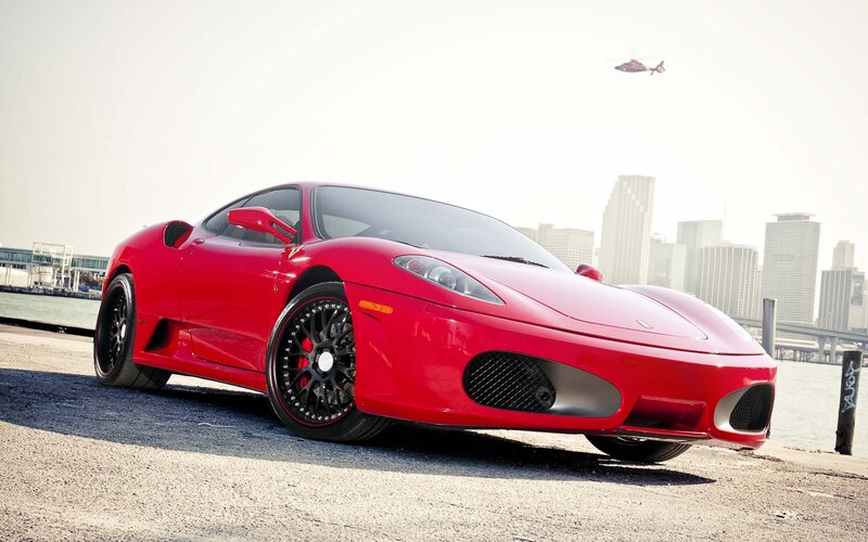 Red Ferrari on waterfront