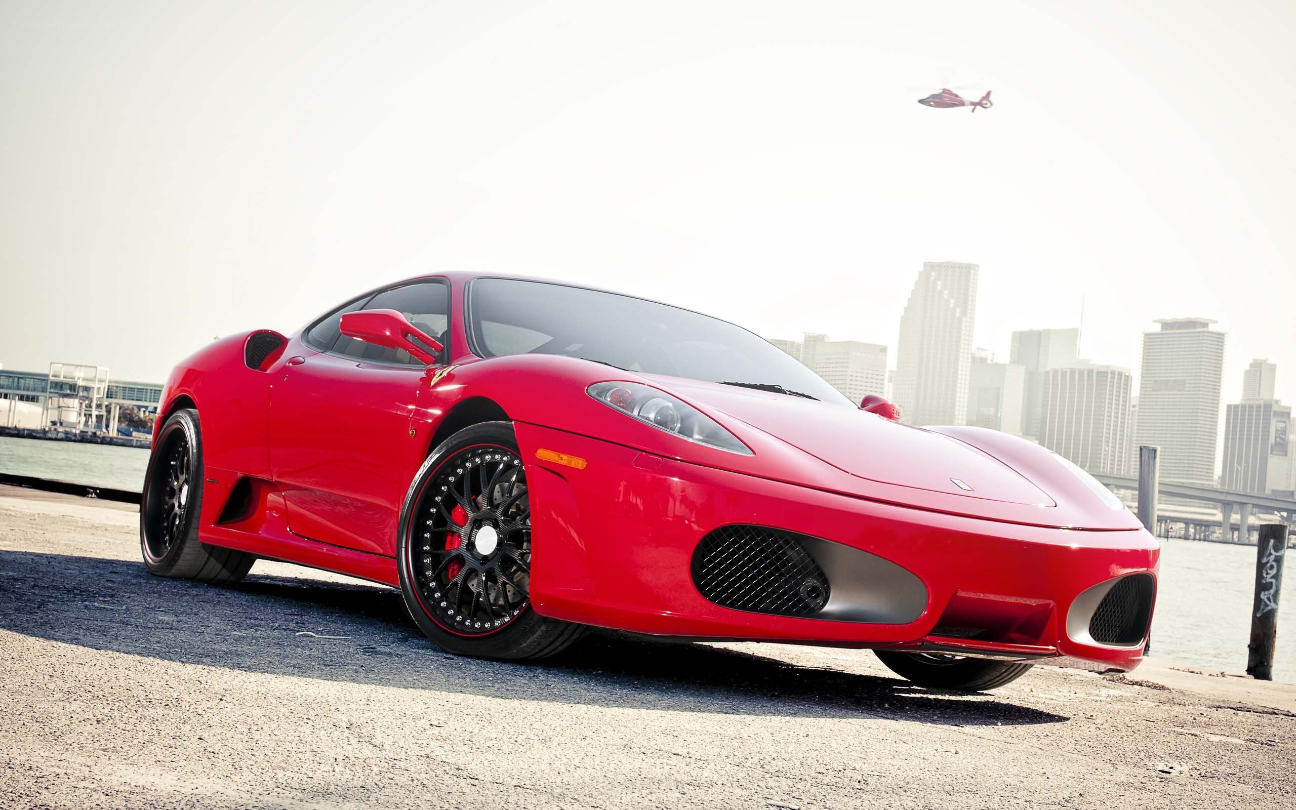 Red Ferrari on waterfront