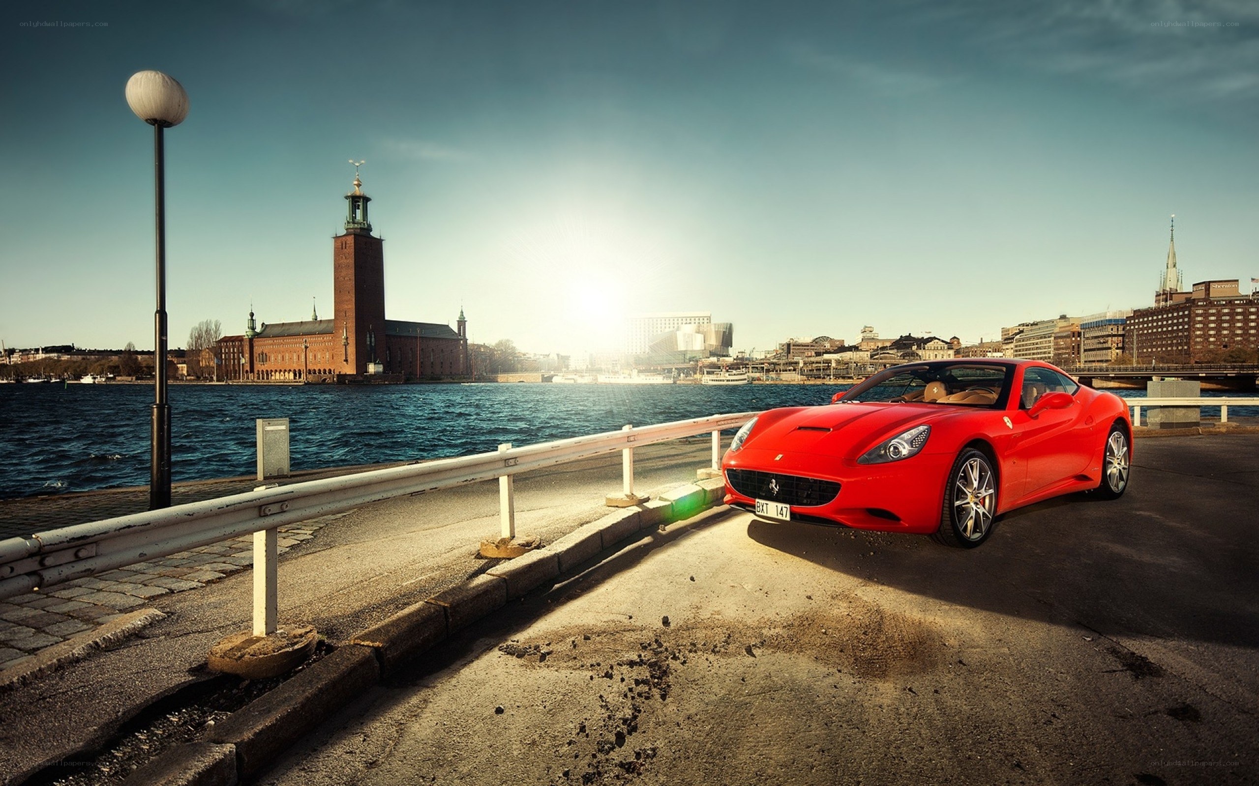 Red Ferrari on waterfront
