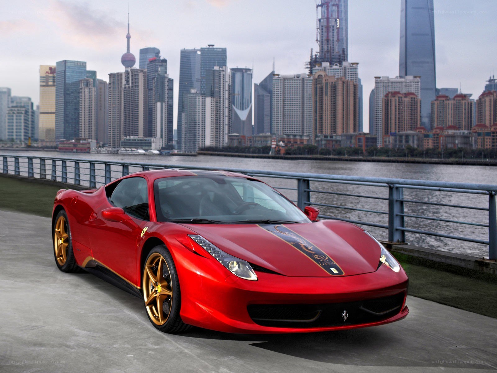 Red Ferrari on waterfront