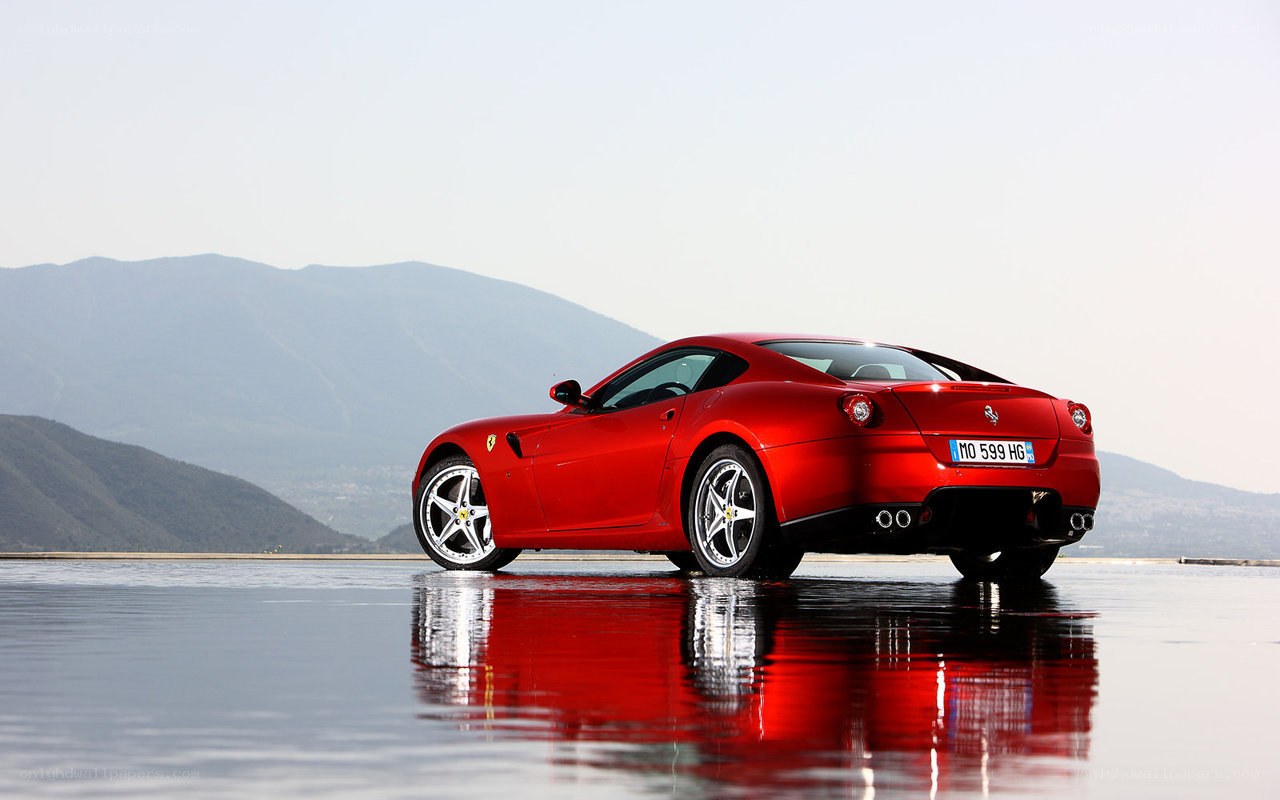 Red Ferrari on wet surface