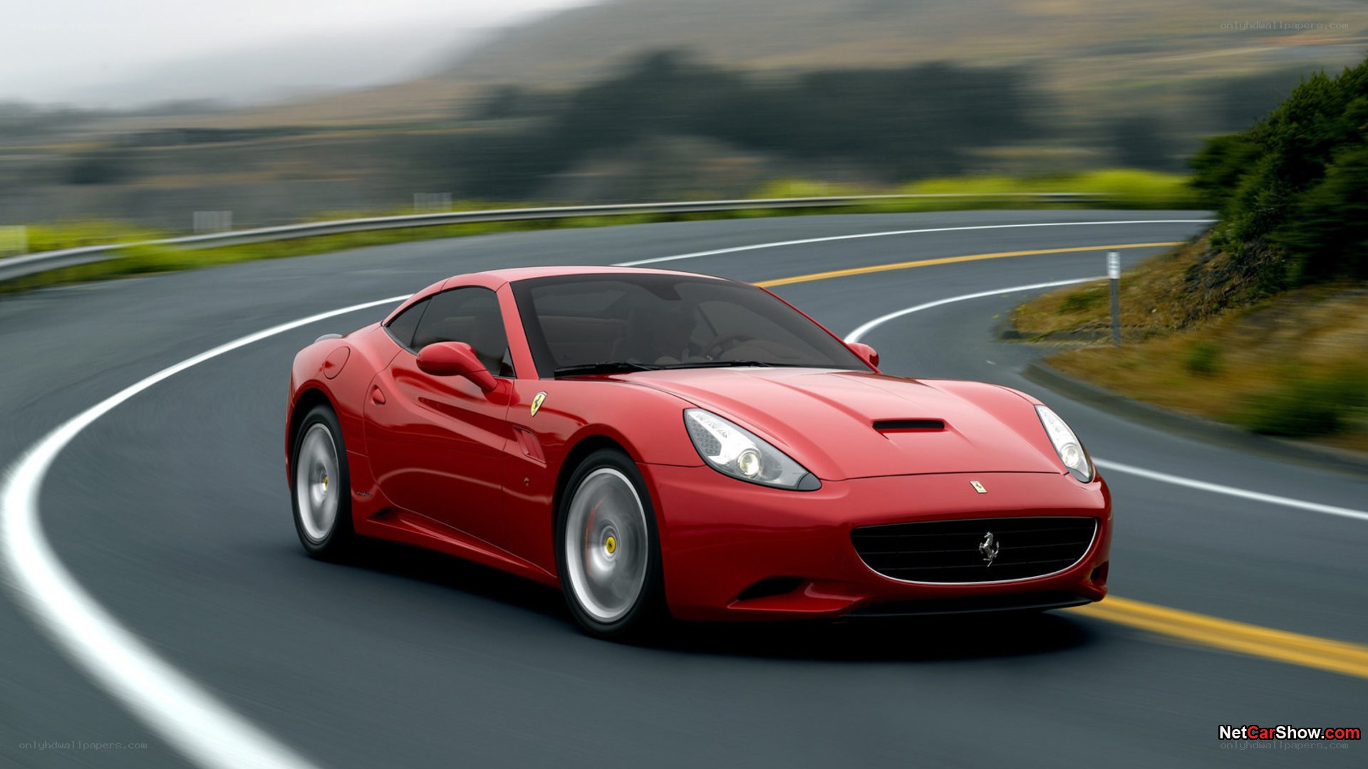 red ferrari on winding road