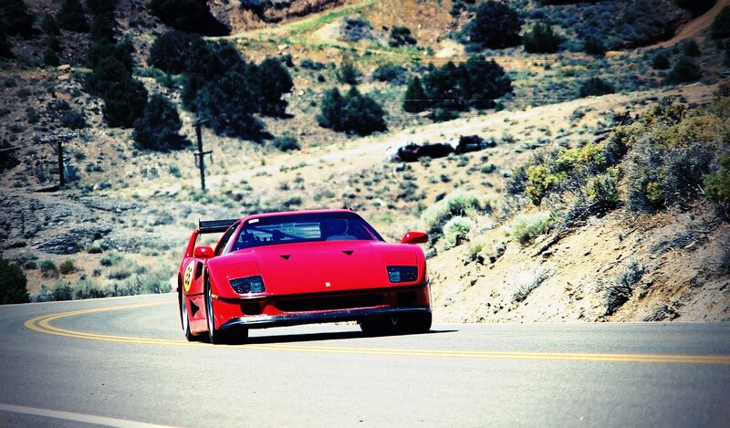 Red Ferrari on winding road