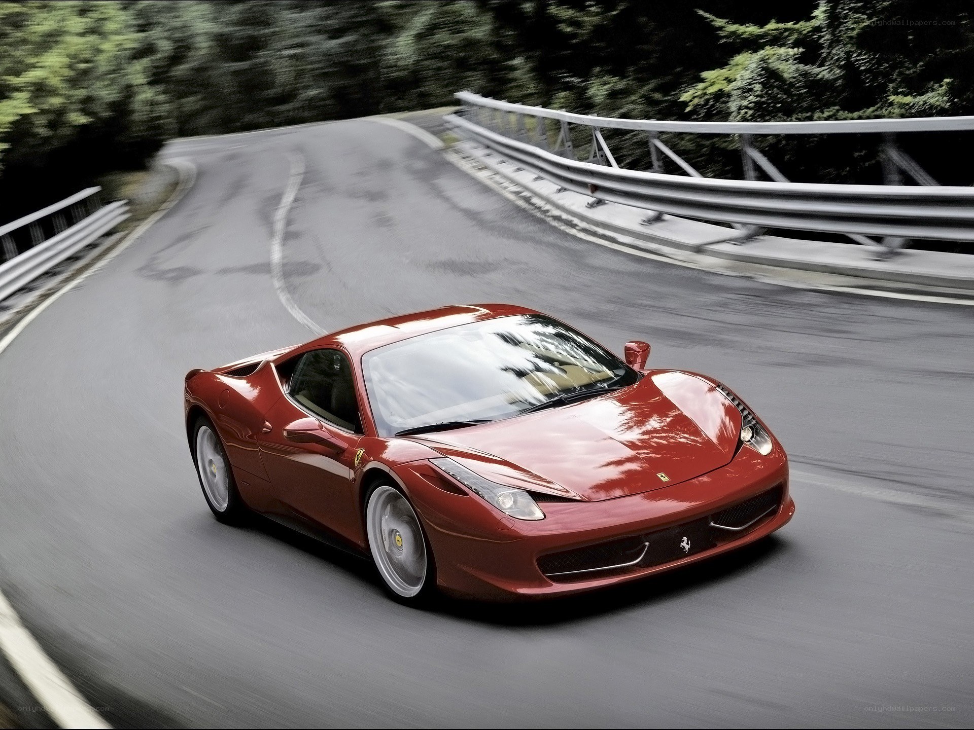 Red Ferrari on winding road