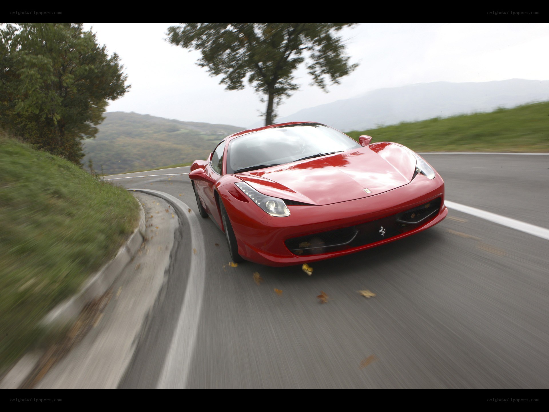 Red Ferrari on winding road