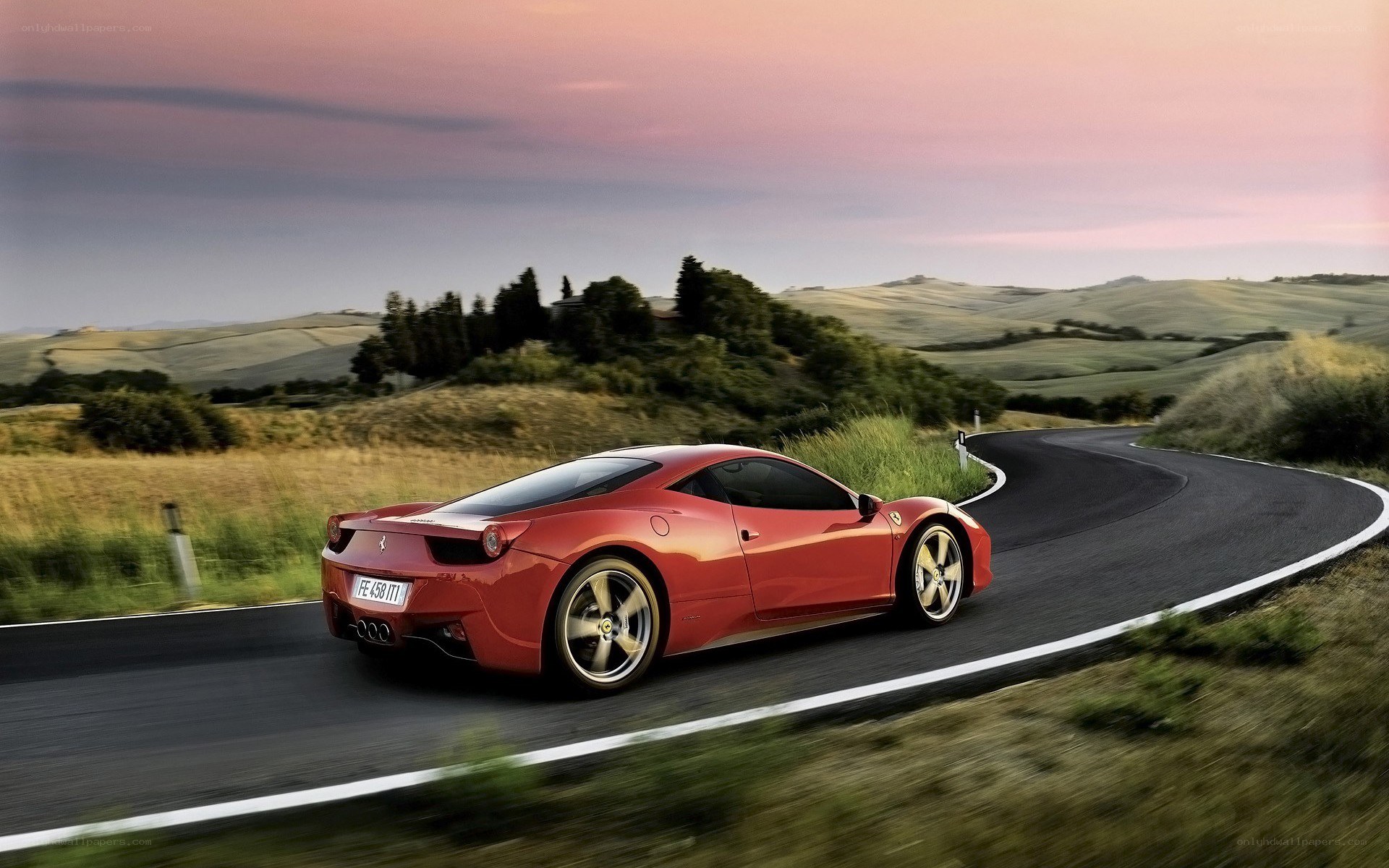 Red Ferrari on winding road