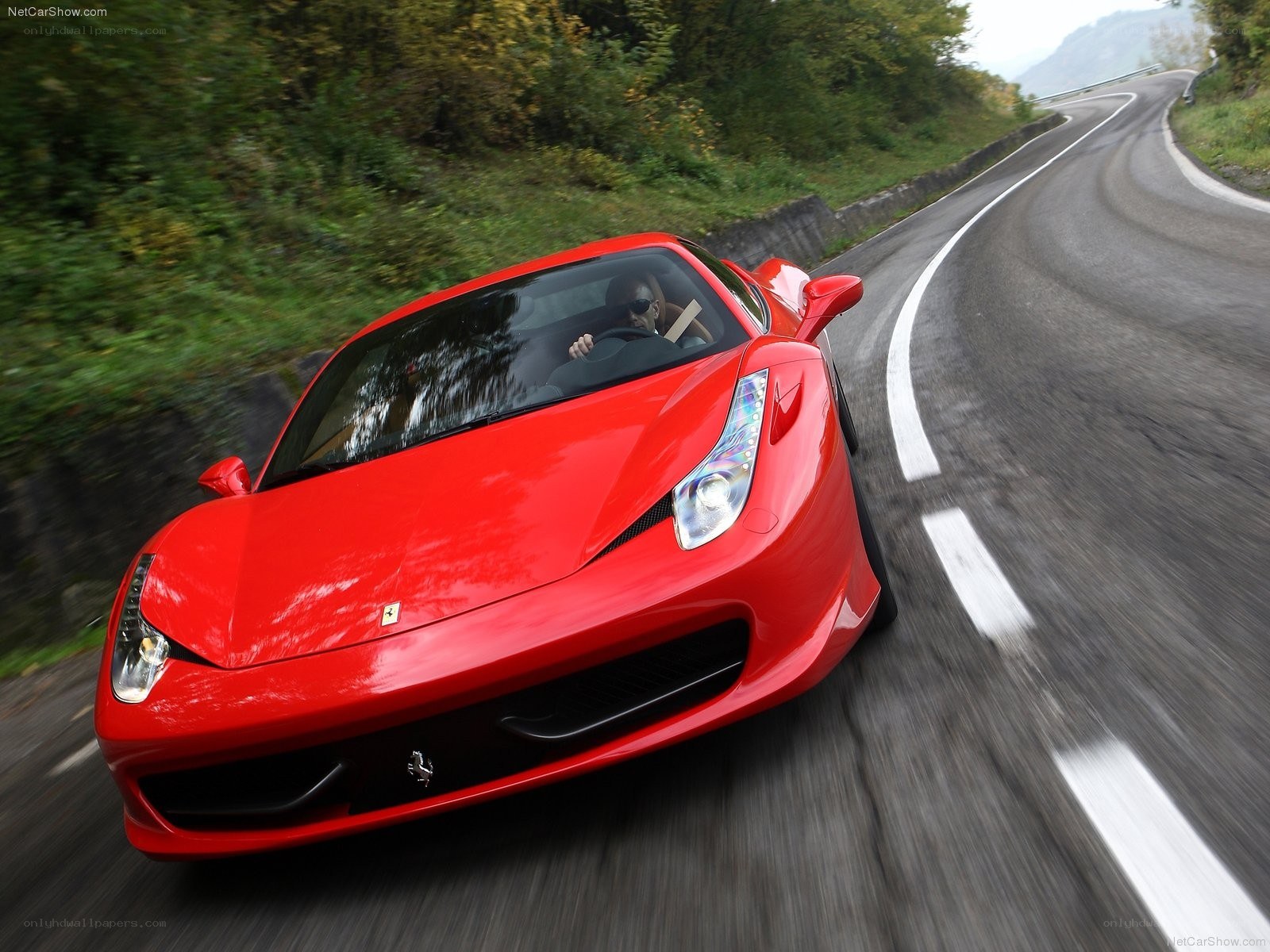 Red Ferrari on winding road