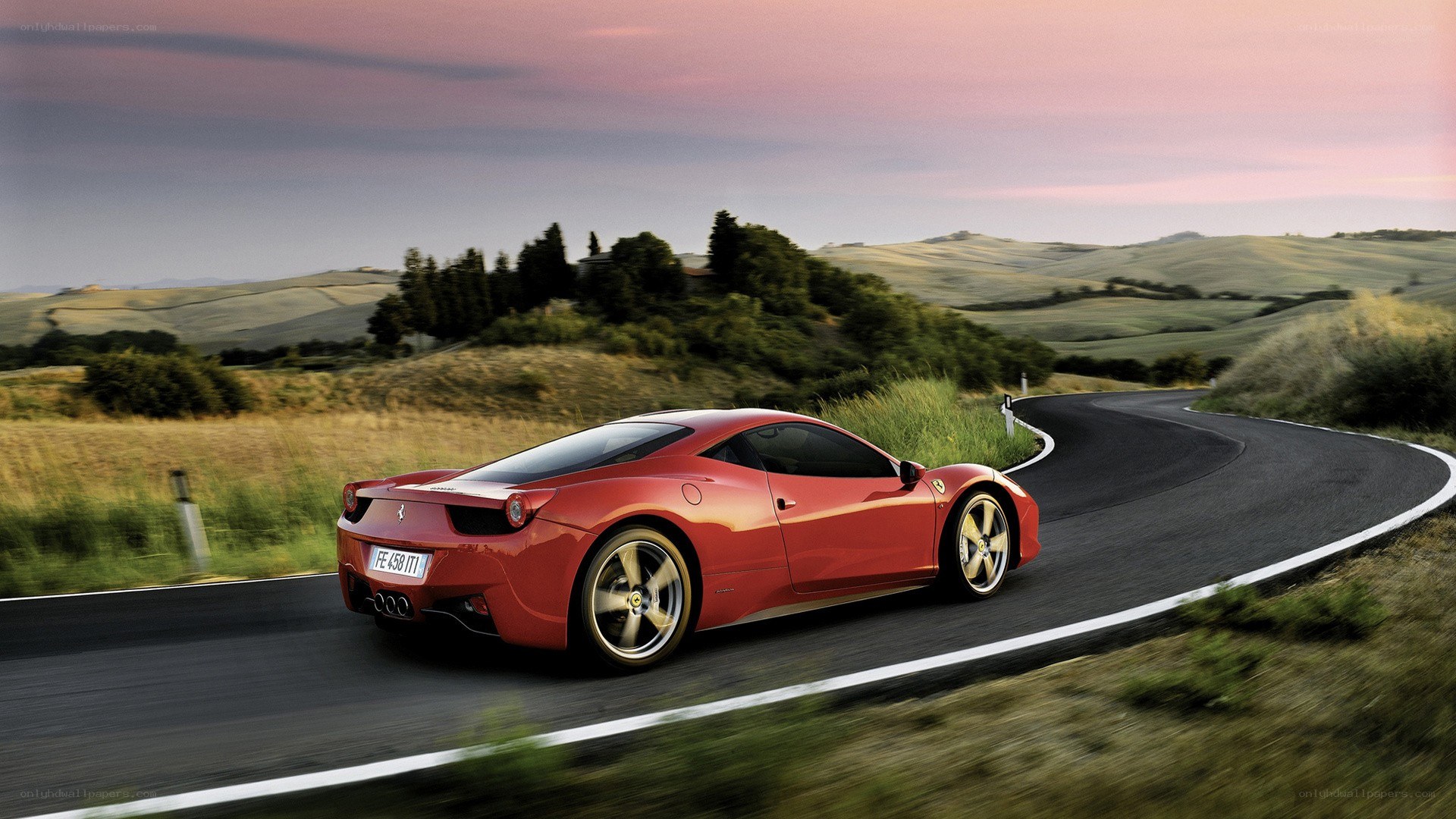 Red Ferrari on winding road