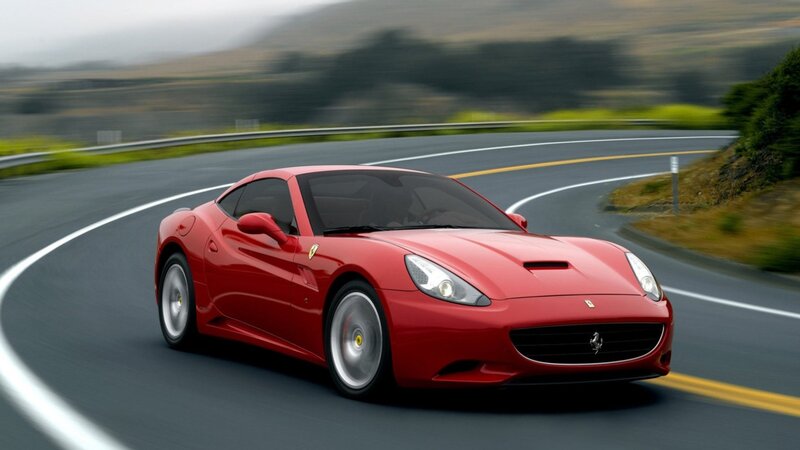 Red Ferrari on winding road