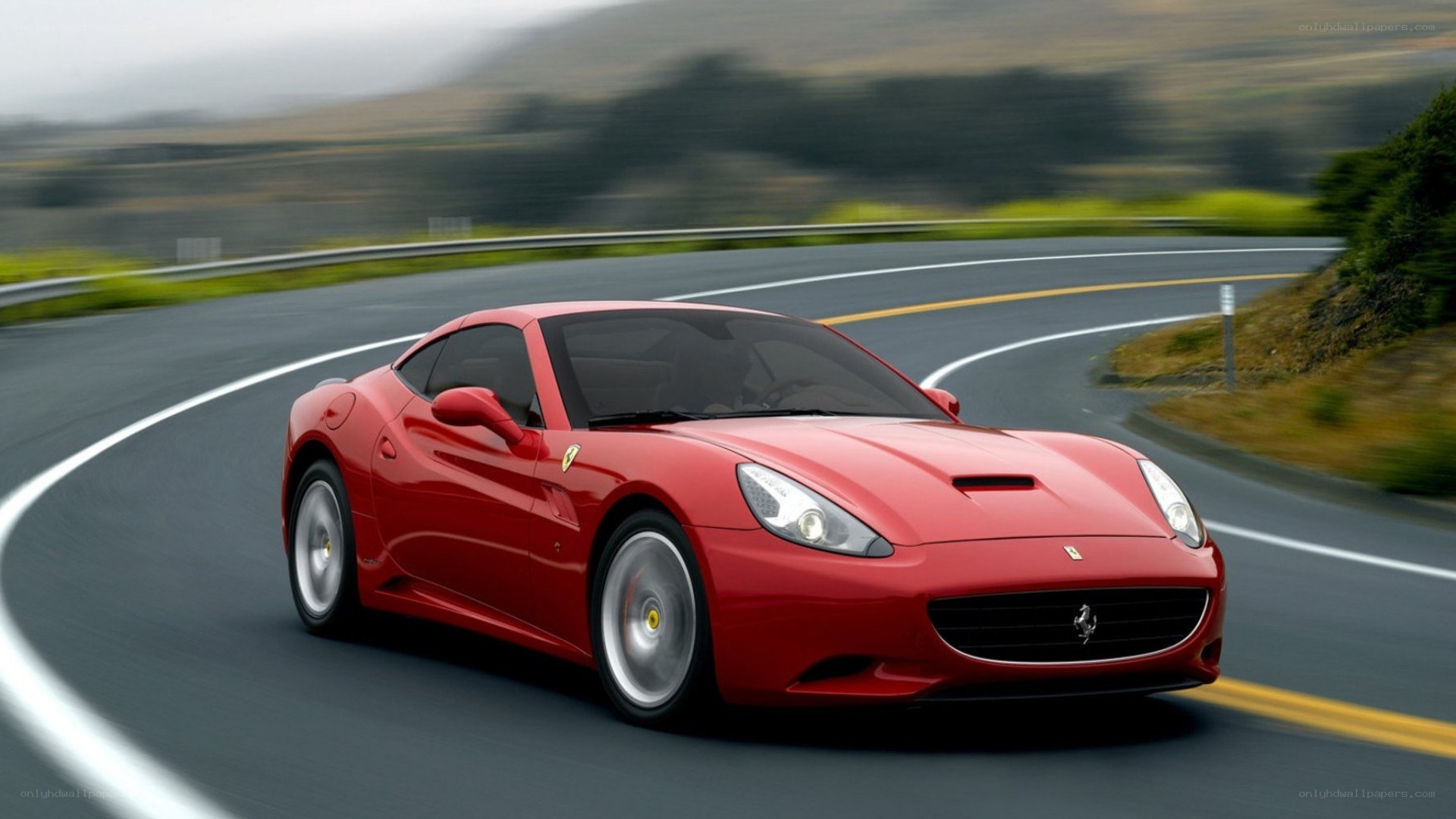 Red Ferrari on winding road