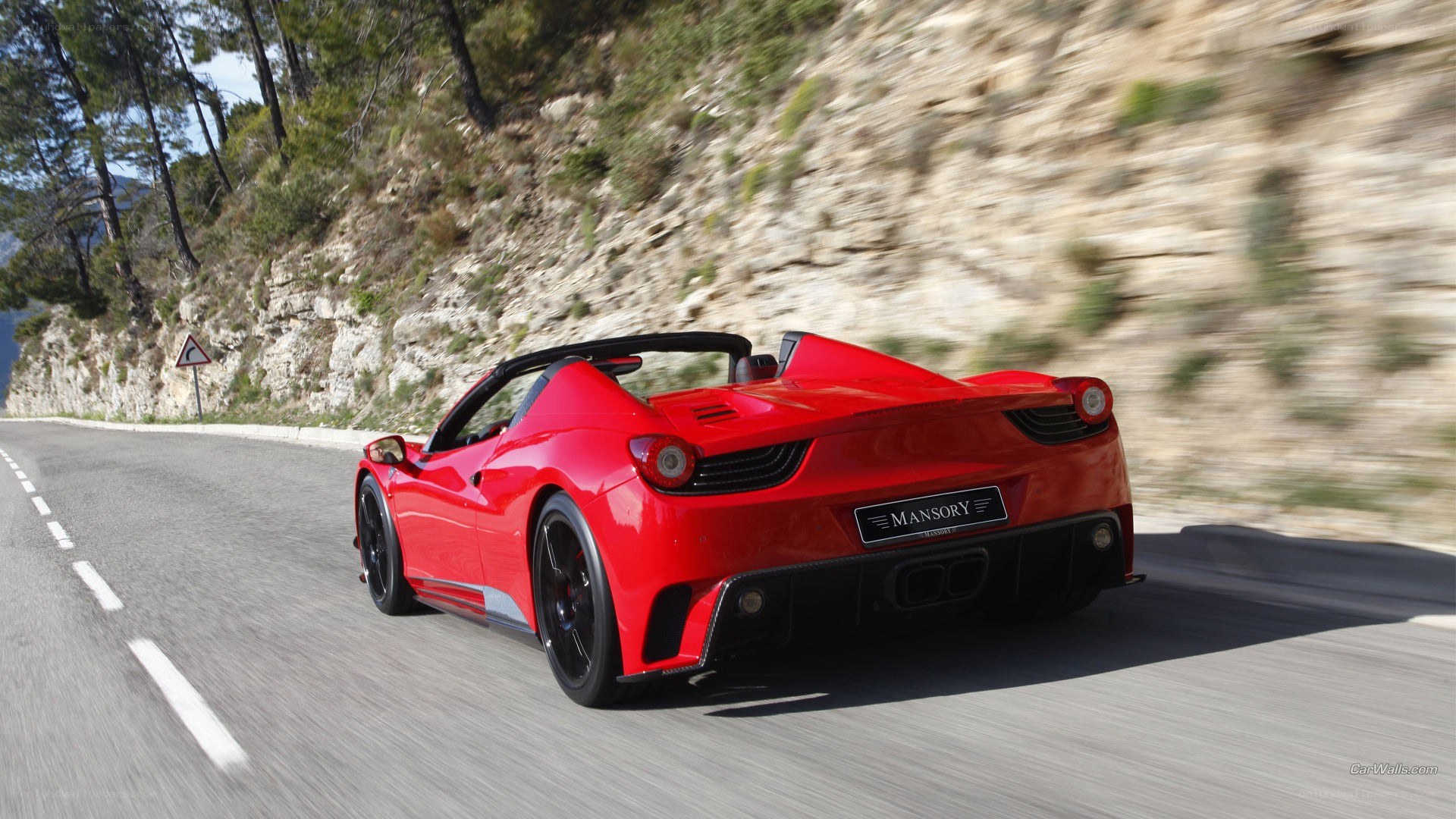 Red Ferrari on winding road