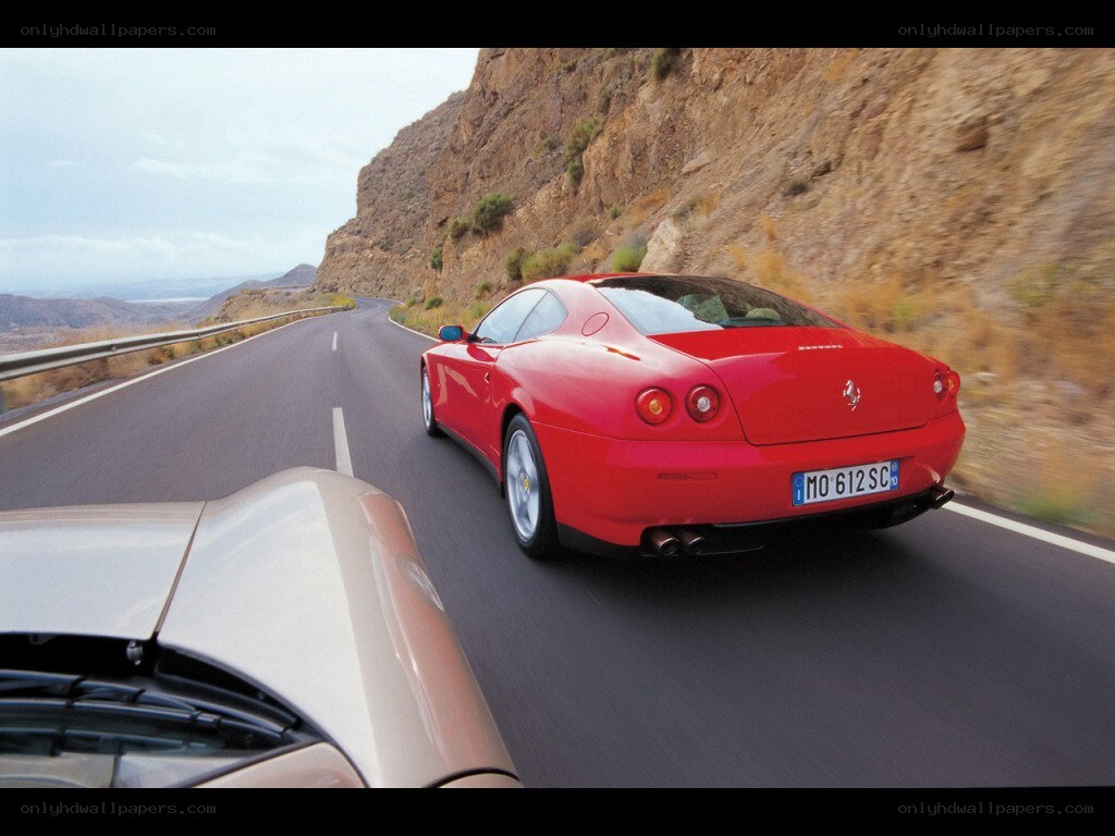 Red Ferrari on winding road