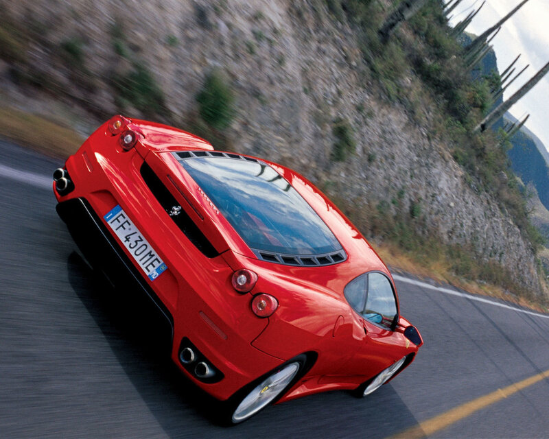 Red Ferrari on winding road