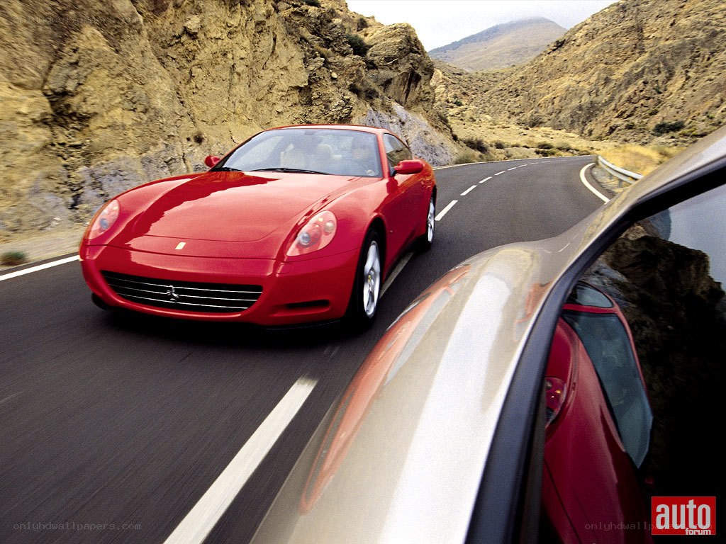 Red Ferrari on winding road